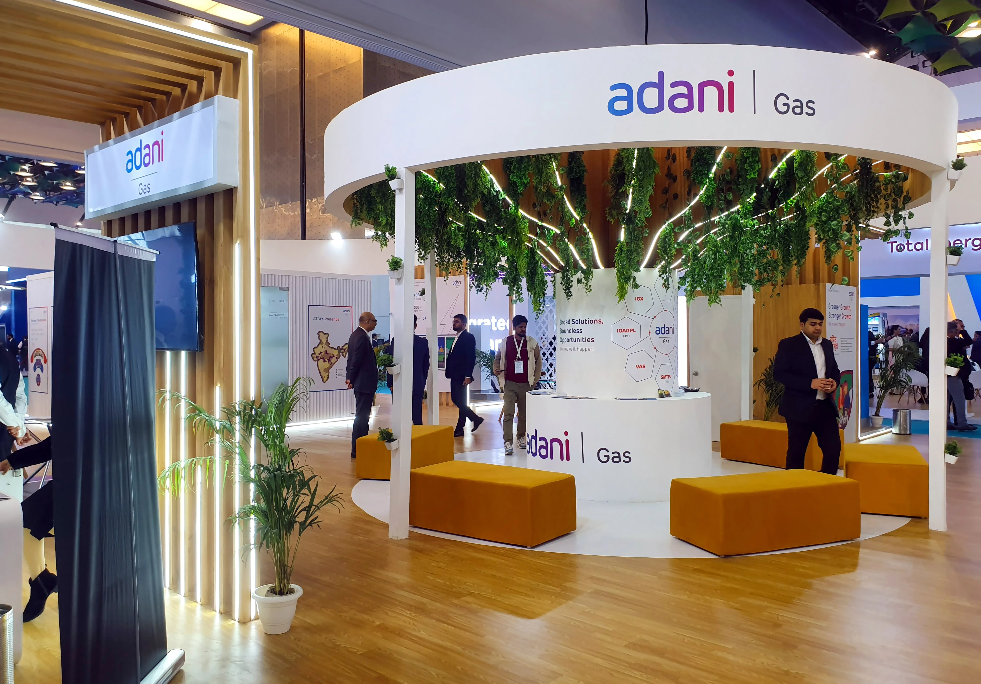 How did Adani Total Gas achieve a 21% rise in operational revenue?