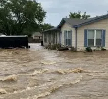 How did flooding in Texas lead to 49 fatalities and 27 missing children?