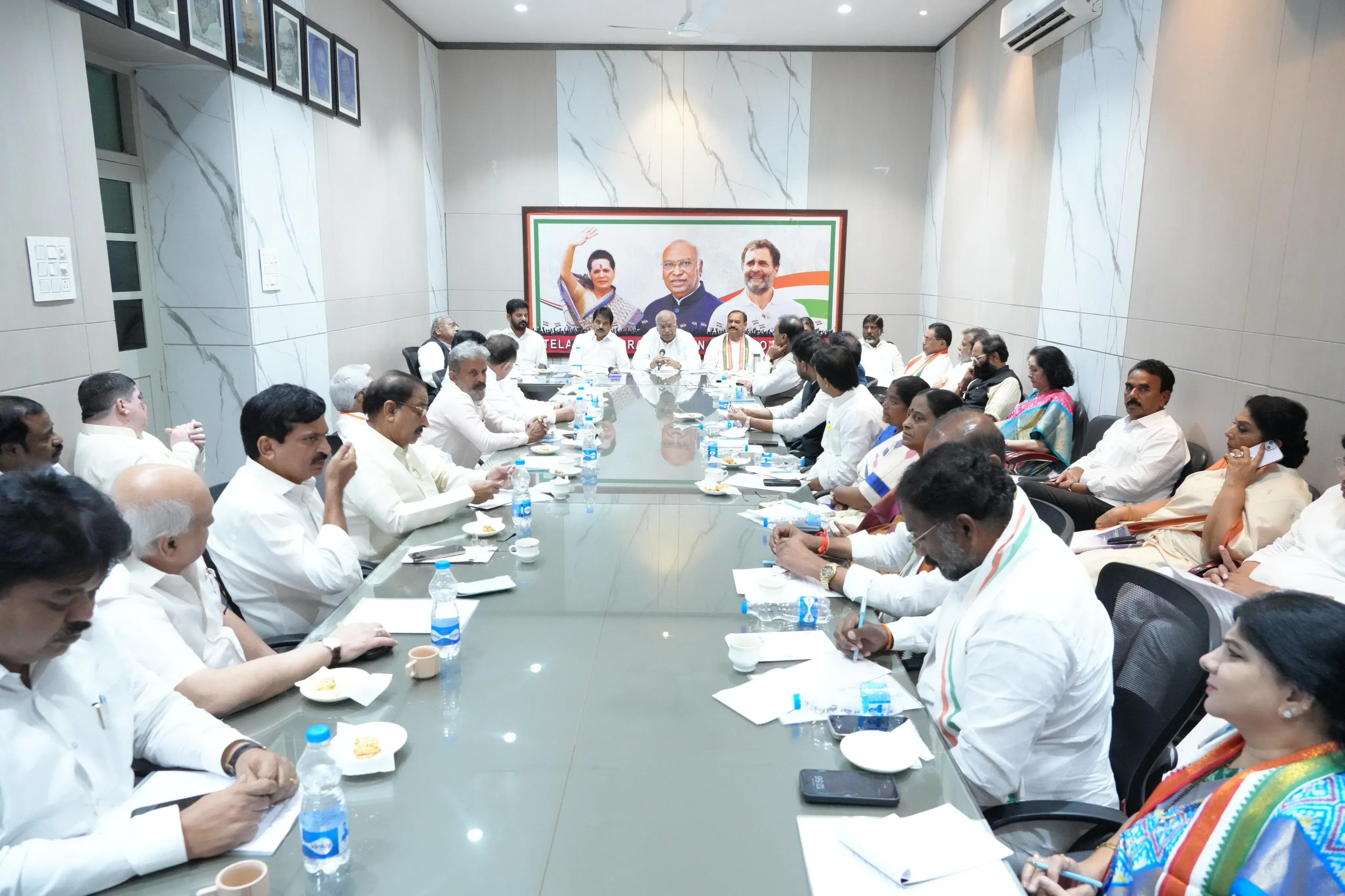 How is Kharge Reviewing the Implementation of Welfare Schemes in Telangana?