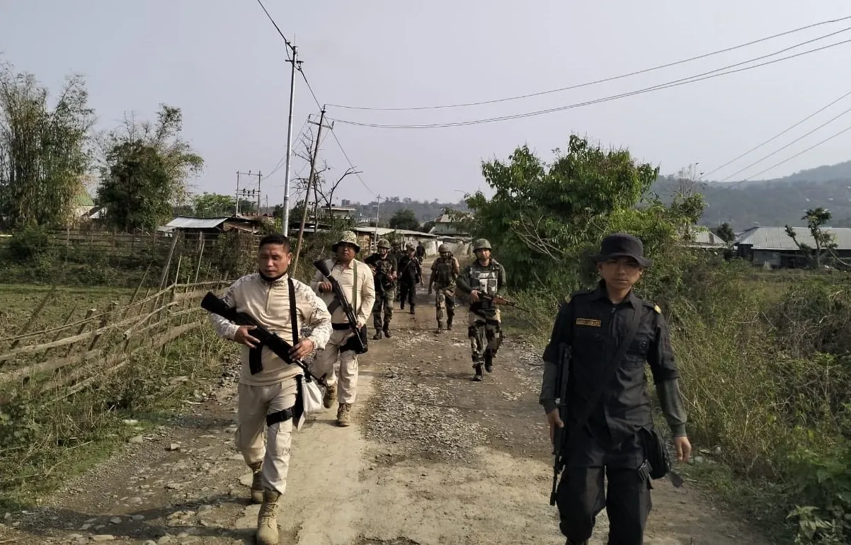 Why is there a manhunt in Manipur for armed cadres giving a gun salute?