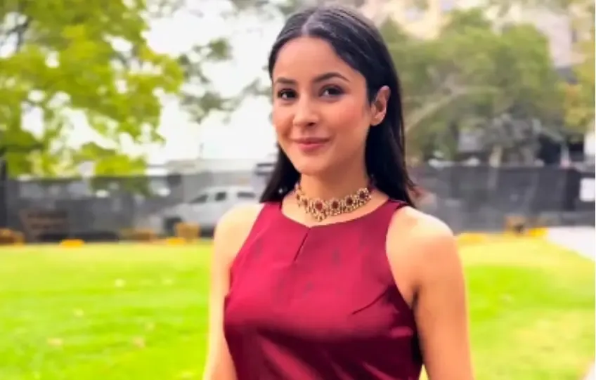 Shehnaaz Gill Embraces Desi Fashion in Maroon Suit Amid Melbourne Rain